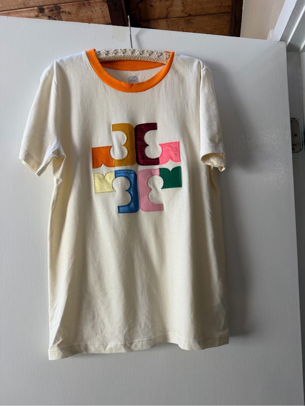 Tory Burch Kids Cream Tee with Multicolor Logo Patches and Orange Neckline